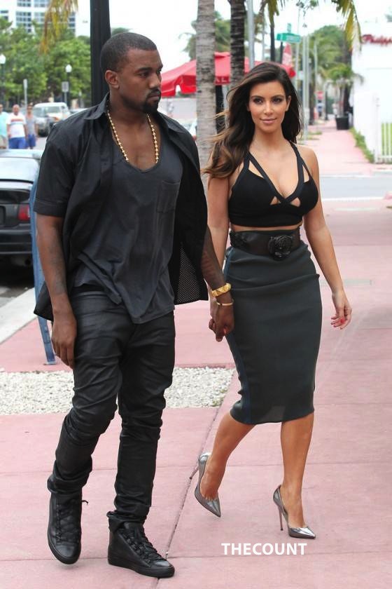 Kim Kardashian Hot skirt Candids in Miami 20 560x840 Kim K Caught Checking Out Her MASSIVE ASSETS