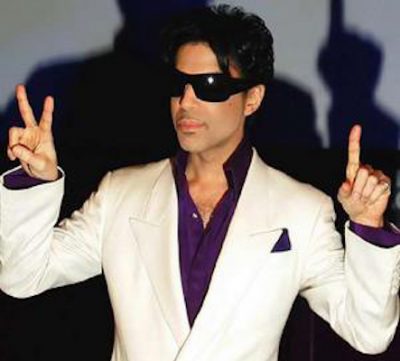 Prince gestures during a press conference in London.