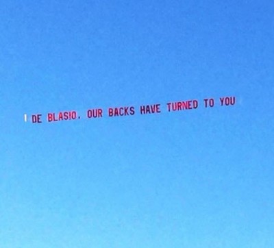 DEBLASIO, OUR BACKS HAVE TURNED TO YOU banner