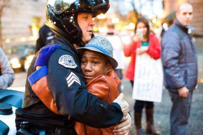 Photo Of Boy Hugging Cop STAGED