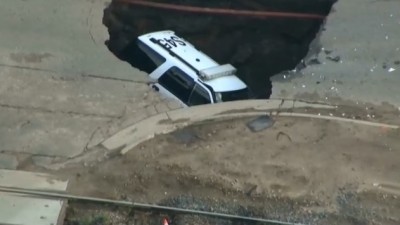 Sinkhole in Colorado swallows cop car 4