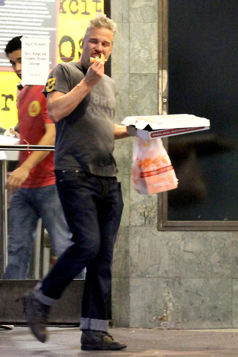 Jason Trawick enjoys a late night pizza in Hollywood